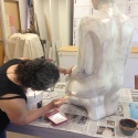 applying gesso to the fiberglass form